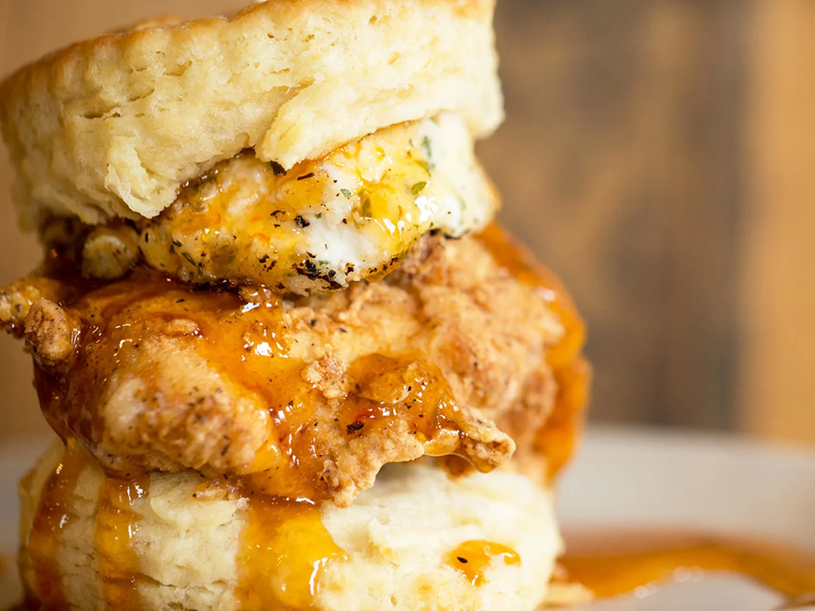 Maple Street Biscuit Company signature dishes The Five and Dime (biscuit with fried chicken, bacon, cheddar, and sausage gravy), The Squawking Goat (biscuit with fried chicken, goat cheese, and pepper jelly).